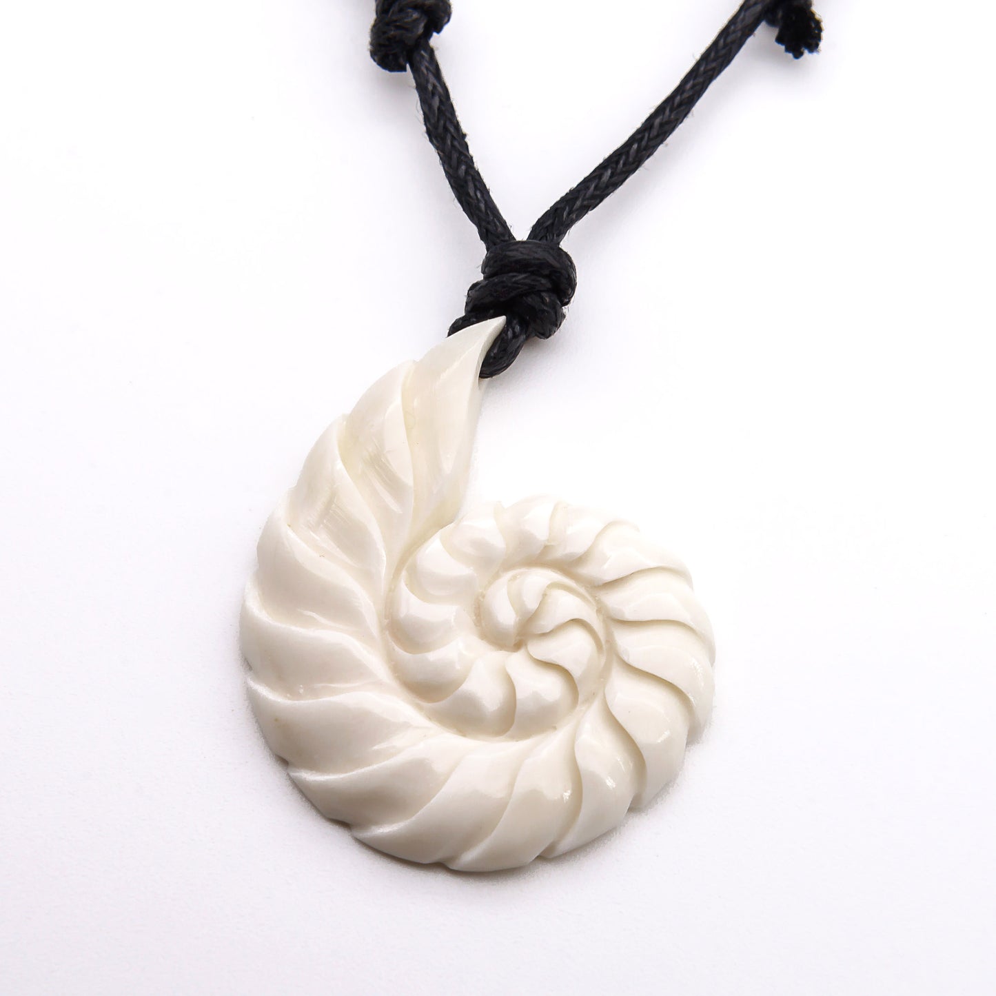 carved bone swirl pendant necklace
